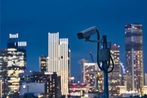 security-camera-against-urban-skyline-2PQ9ZB7